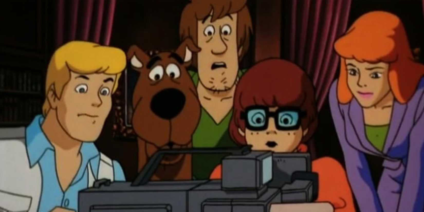 The Mystery Inc. gang watches a video tape in 'Scooby-Doo! On Zombie Island'