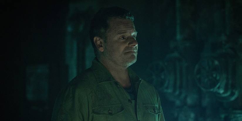 A side profile of Jimmy smiling in Silo.