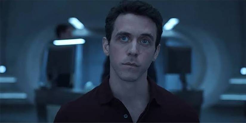 Troy staring at a screen in Silo.
