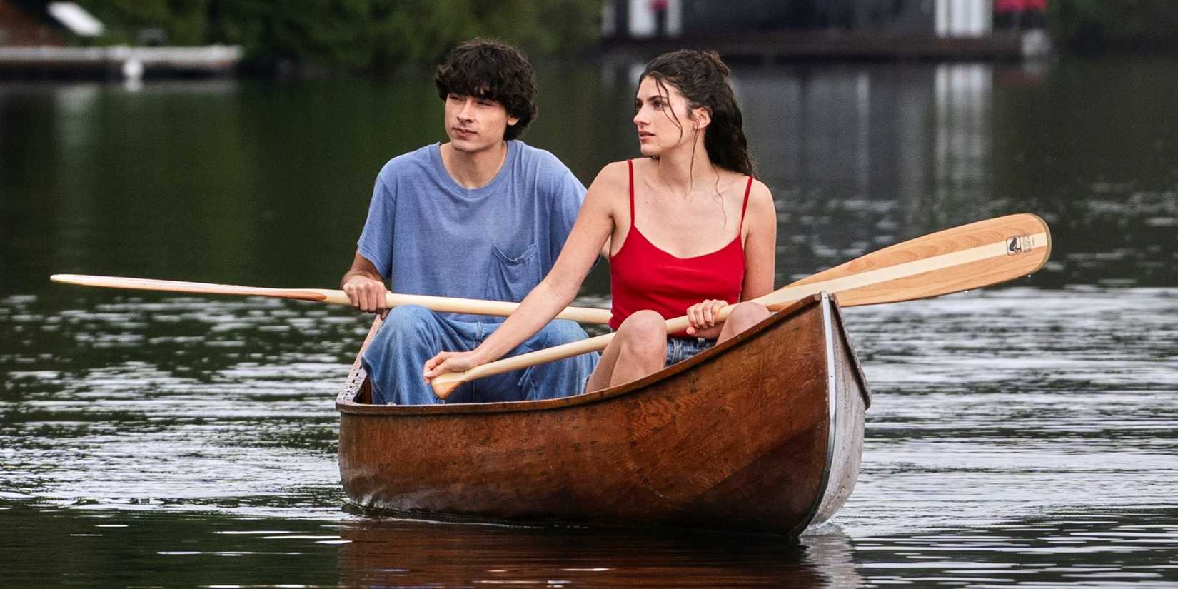 Ella Rubin as Annie sitting in a boat on the lake with Jacob Whiteduck-Lavoie as Ellis in Sterling Point