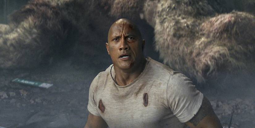 Dawyne Johnson in a ripped shirt looks worried in 'Rampage'