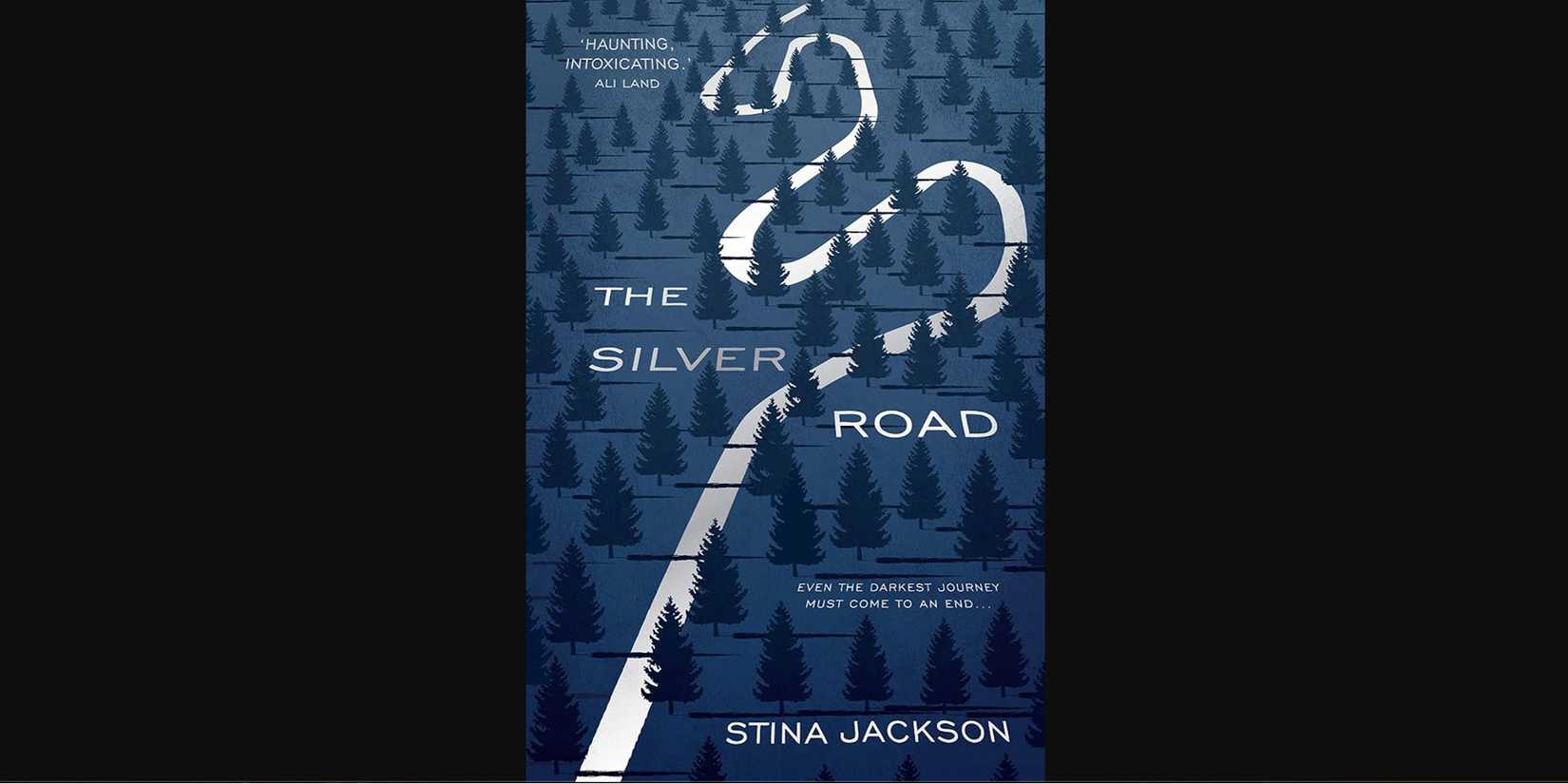 The cover for Stina Jackson's Silver Road depicting Swedish woods and a silver winding road 