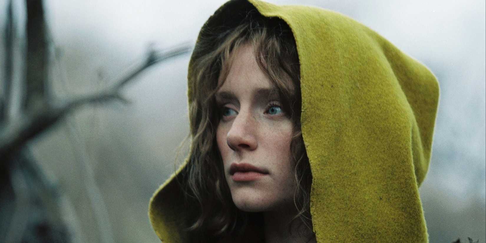 Bryce Dallas Howard wearing a yellow cloak in The Village
