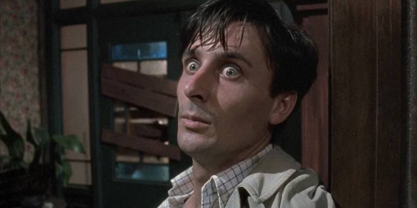 A man looking afraid at something off camera in Braindead / Dead Alive