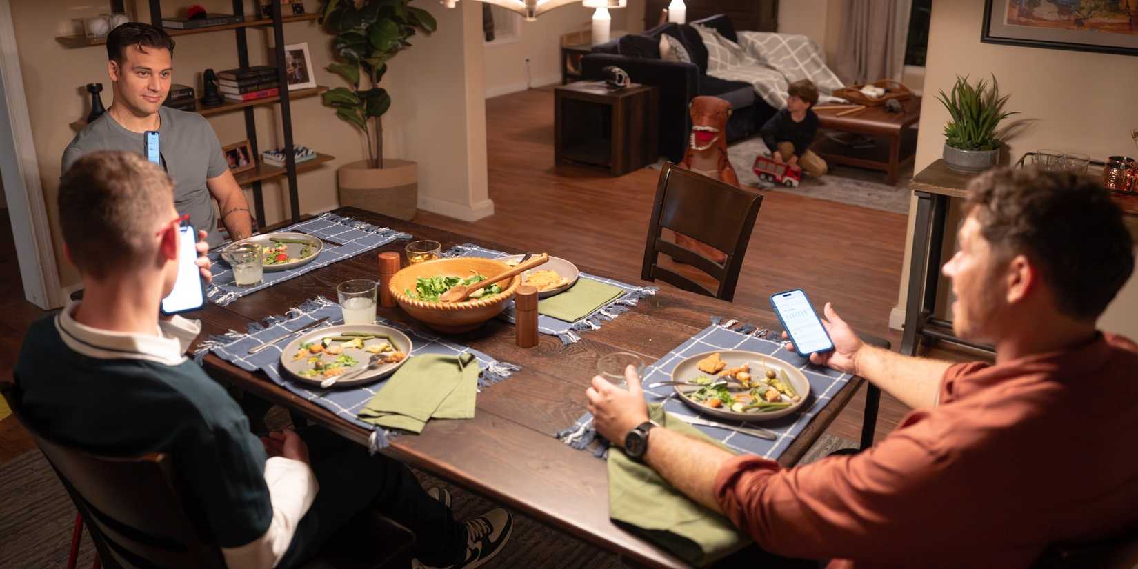 Eddie, Buck, and Christopher eating dinner while Theo plays in the background in the Season 10 premiere of 9-1-1
