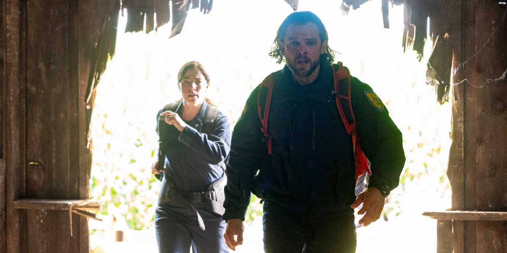 Olivia Thirlby as CJ running in behind Max Thieriot as Bode for an emergency response in Fire Country