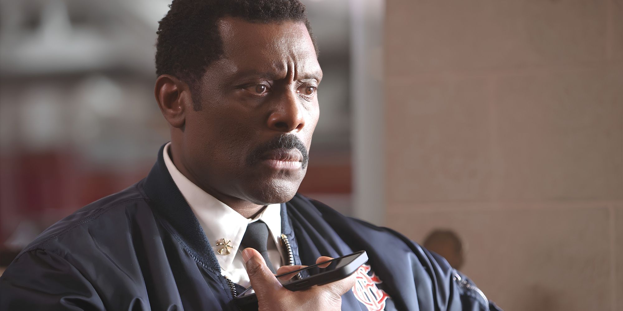 Chief Boden (Eamonn Walker) looks troubled as he listens to phone in Chicago Fire.