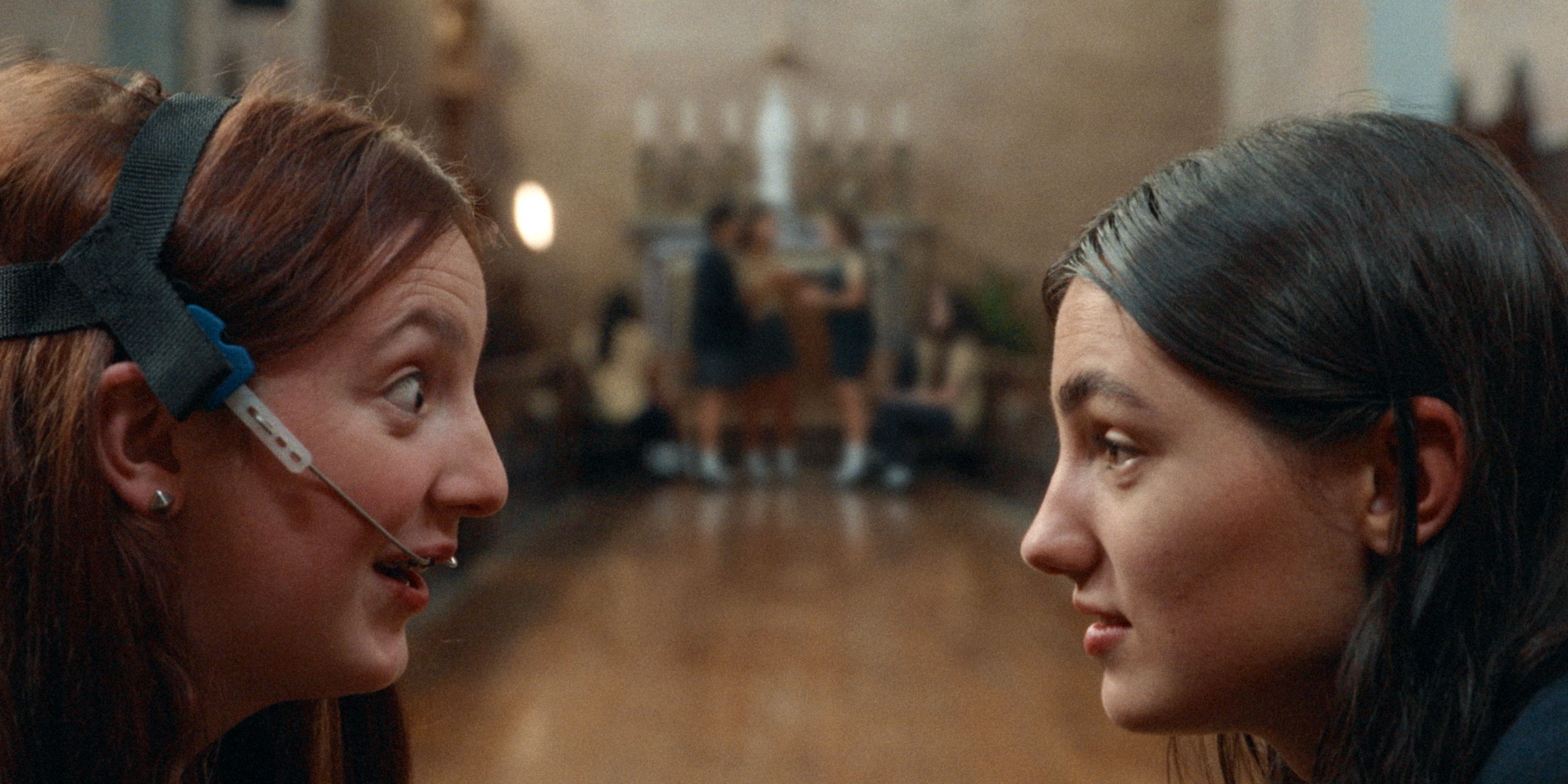 Adi Madden Cabrera as Edie in profile across from McKenna Tuckett as Frances in Edie Arnold is a Loser