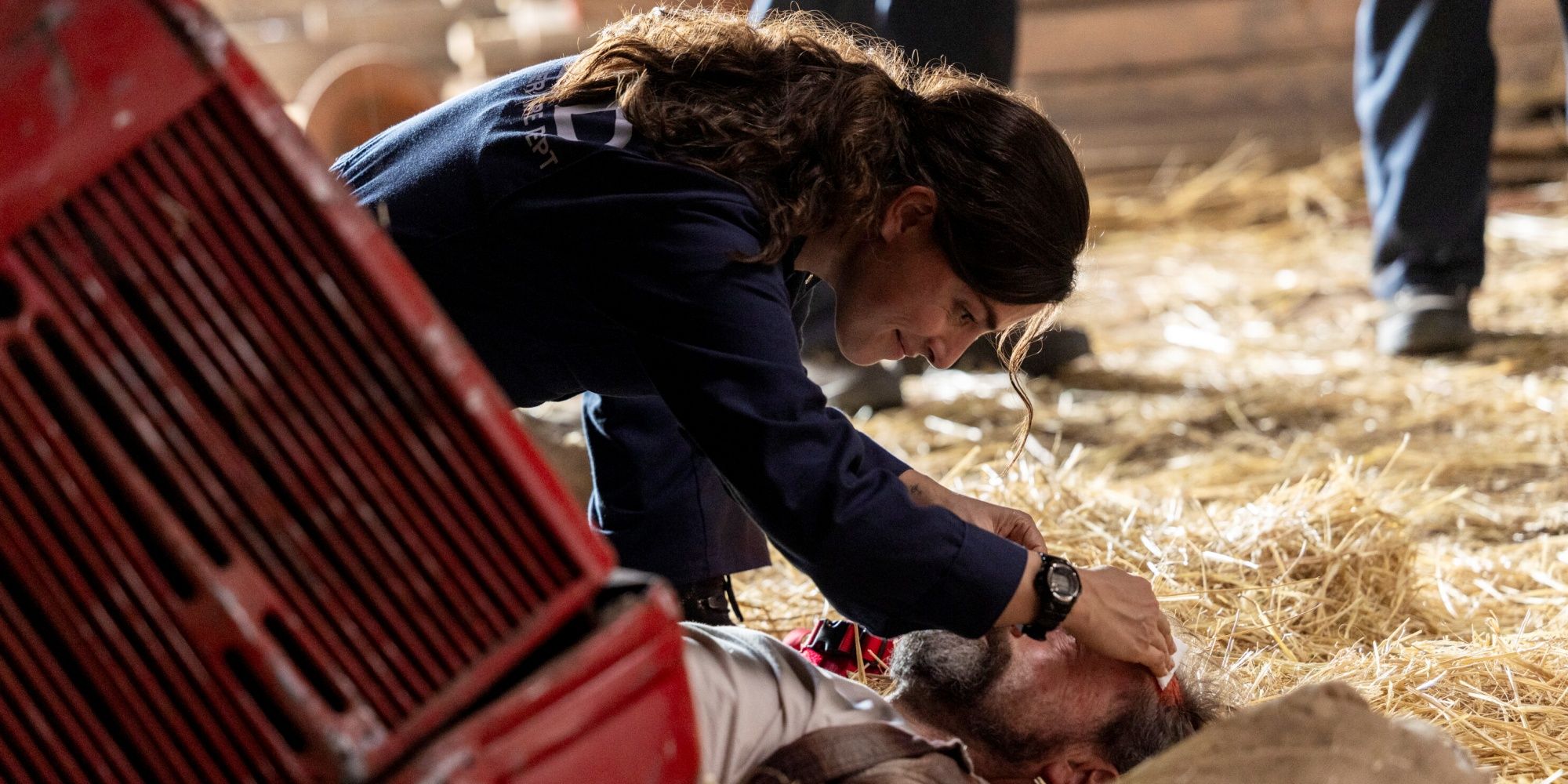 Olivia Thirlby as CJ helping someone in need on an emergency call in Fire Country