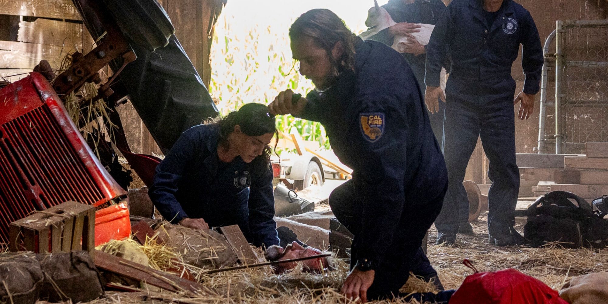 Olivia Thirlby as CJ with Max Thieriot as Bode helping someone in need on an emergency call in Fire Country