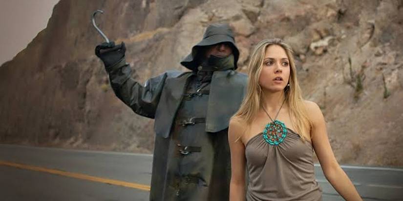 Hooded man with hook about to hit woman in 'I'll Always Know What You Did Last Summer'