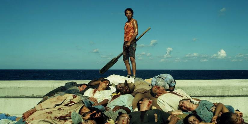 A man standing on a pile of people in 'Juan of the Dead'
