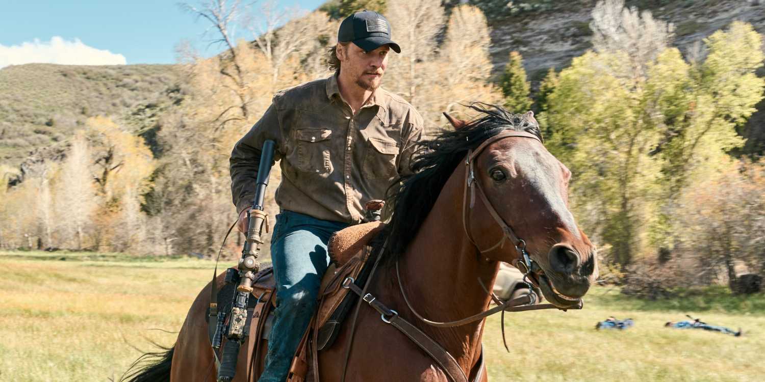 Luke Grimes as Kayce Dutton riding on a horse while holding a shotgun in Marshals Season 2
