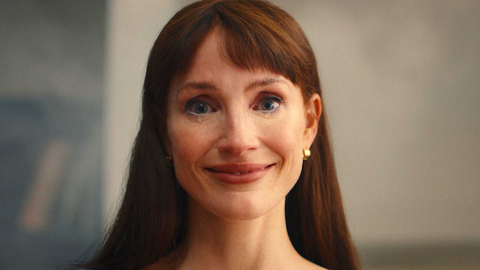 Jessica Chastain smiling with a tear trickling from her eye in 'Other Mommy'