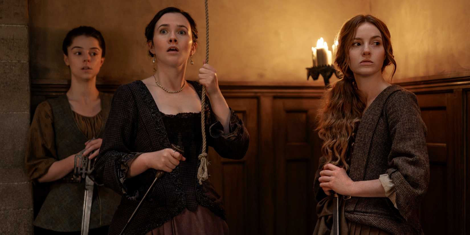 Harriet Slater standing with Sadhbh Mailn and Bobby Rainsbury in Outlander: Blood of My Blood Season 2