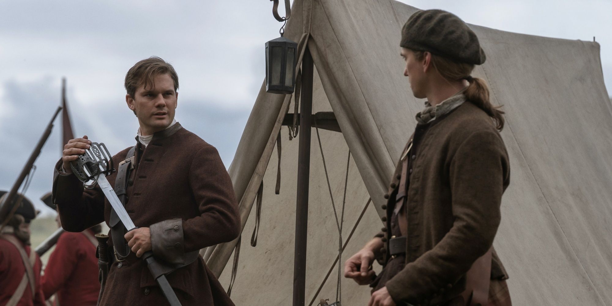 outlander-blood-of-my-blood-season-2-jeremy-irvine-terence-rae-1 The Decade's Best Fantasy Spin-Off Is Officially a Surprise HBO Max Sensation