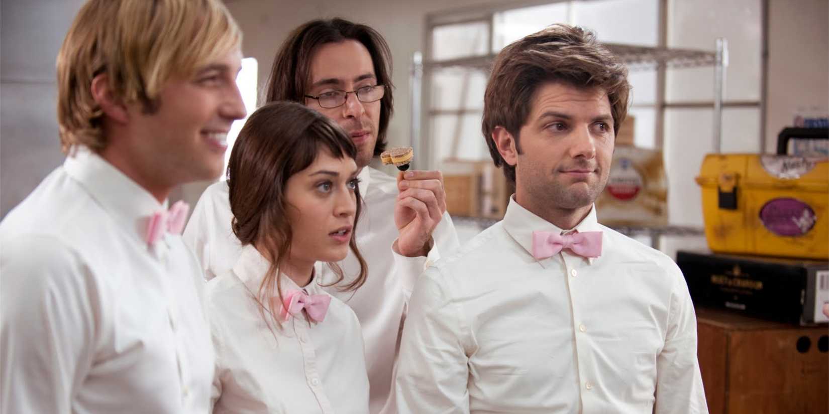 Ryan Hansen as Kyle Bradway, Lizzy Caplan as Casey Klein, Martin Starr as Roman DeBeers, and Adam Scott as Henry Pollard in Party Down.