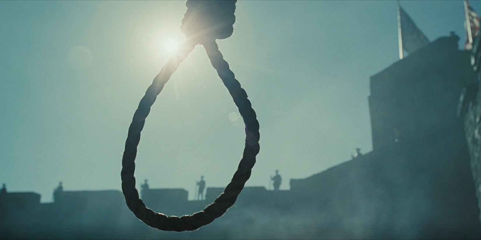 A hangman's noose with the sun in the background