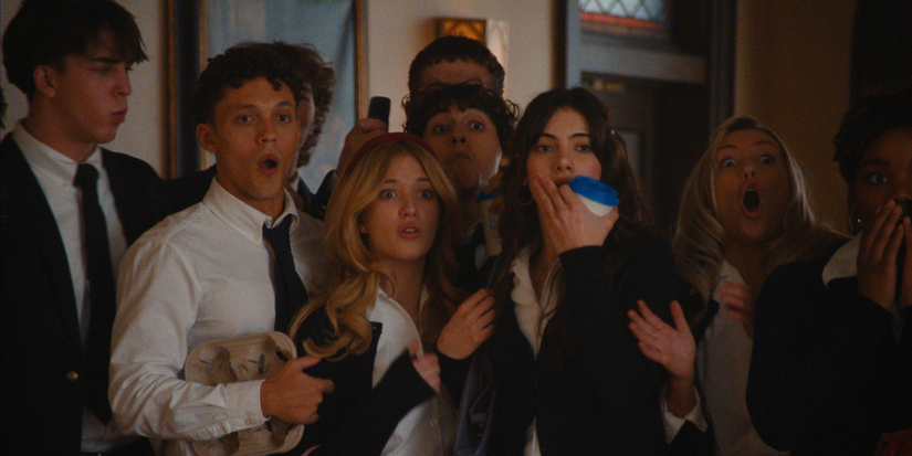 Teenage students of a Catholic school look shocked at something