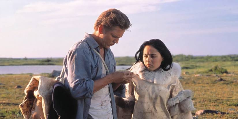 Barry Pepper and Annabella Piugattuk in the Canadian wilderness in The Snow Walker.