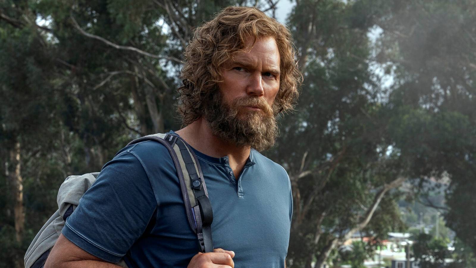 Chris Pratt as James Reece standing outside with a beard and a backpack in The Terminal List Season 2