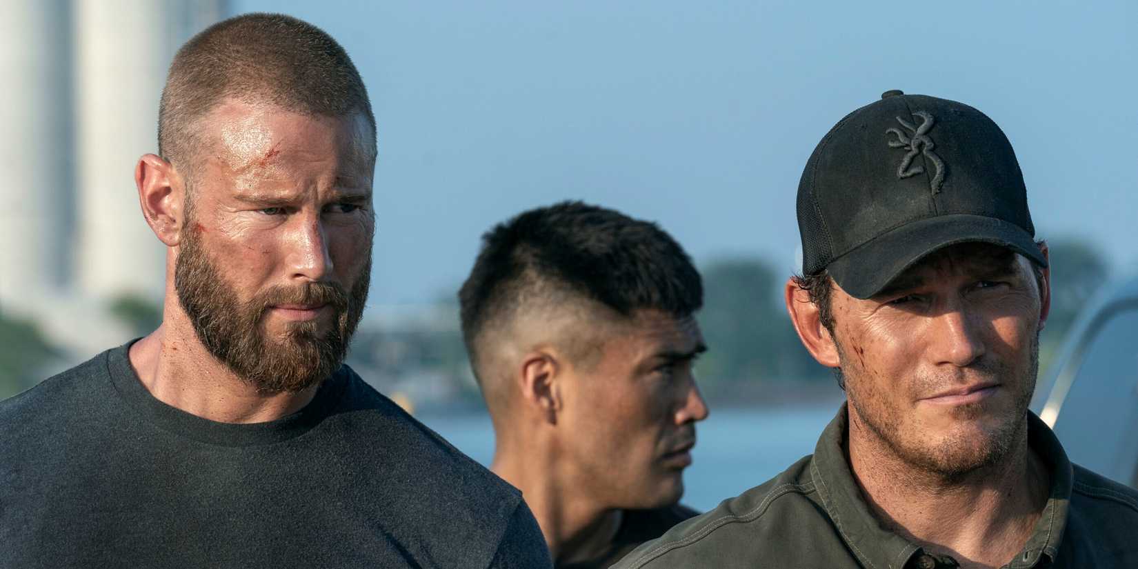 Tom Hopper as Raife Hastings walking outside next to Chris Pratt as James Reece in The Terminal List Season 2