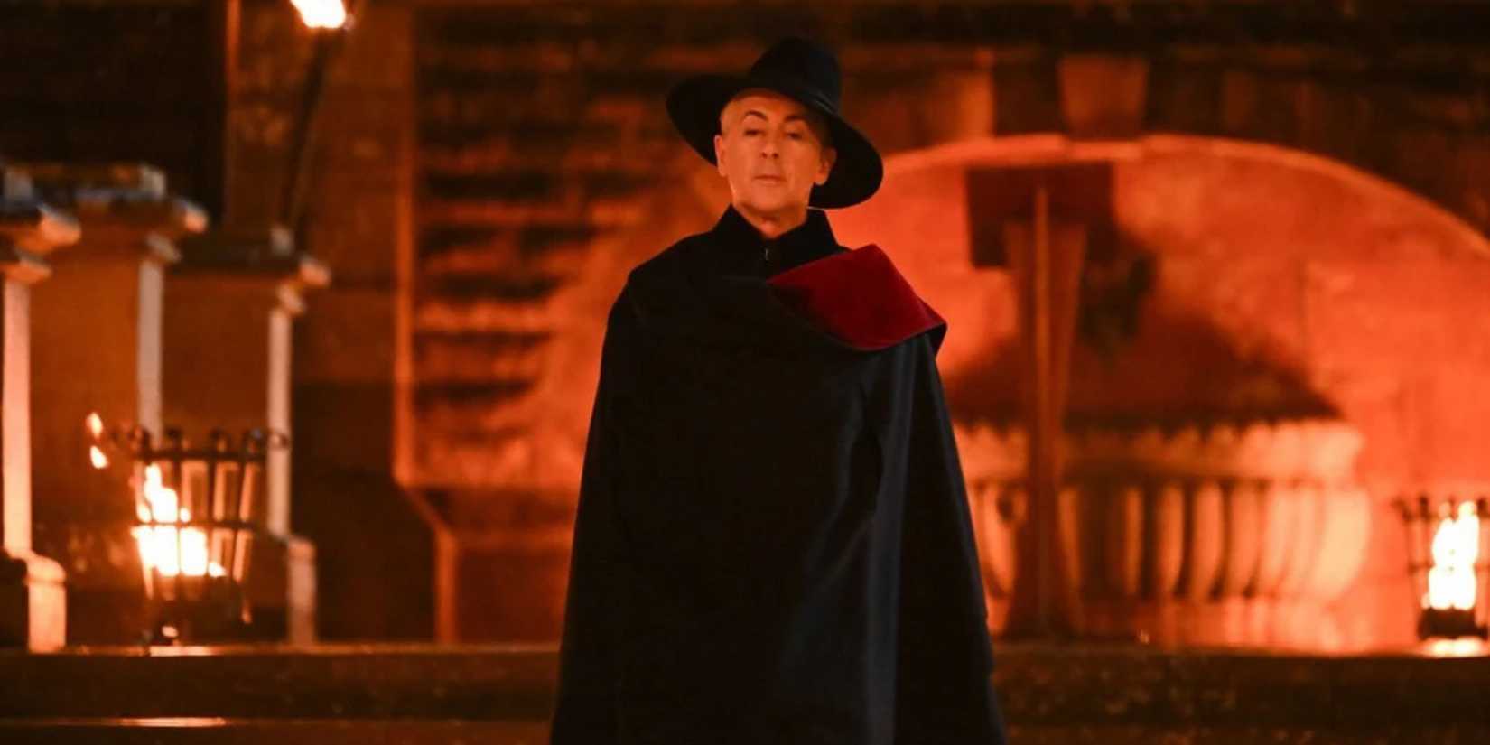 Alan Cumming stands outside the castle on 'The Traitors: New Blood.'