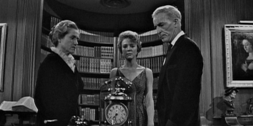 Three characters staring at a clock in 'The Twilight Zone' episode "The Lateness of the Hour."