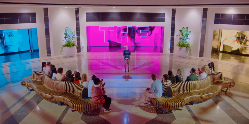 Contestants of Win The Mall sitting on couches facing the host