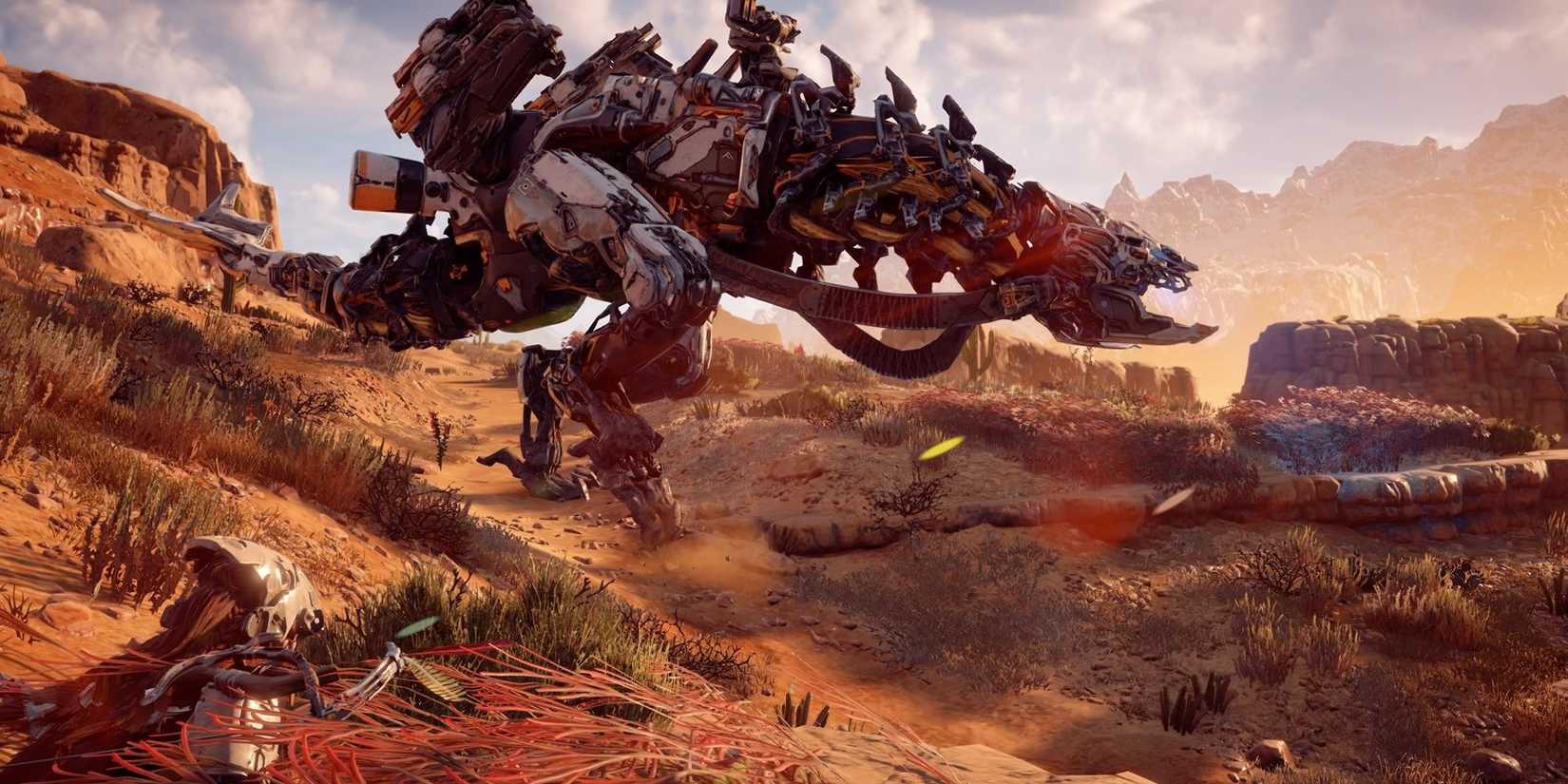 A mechanical dinosaur in a desert in Horizon Zero Dawn