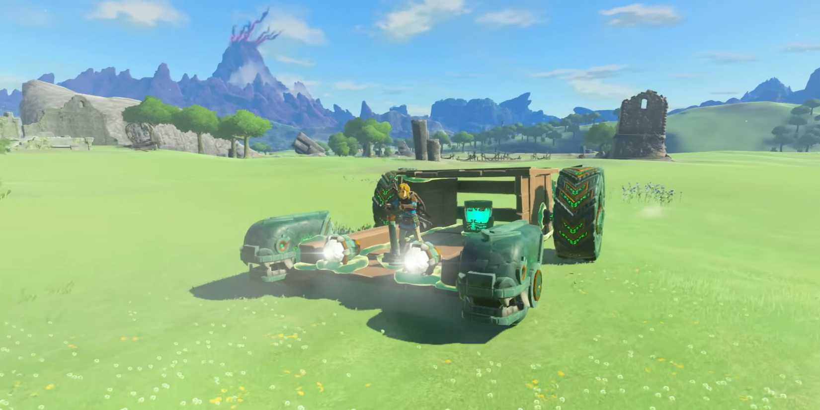 Link riding a car across an open field in The Legend of Zelda: Tears of the Kingdom