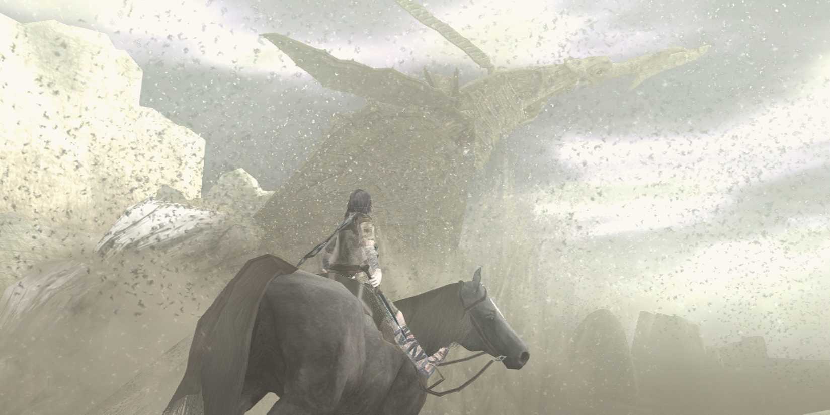 A figure on horseback facing a sandy colossus in Shadow of the Colossus
