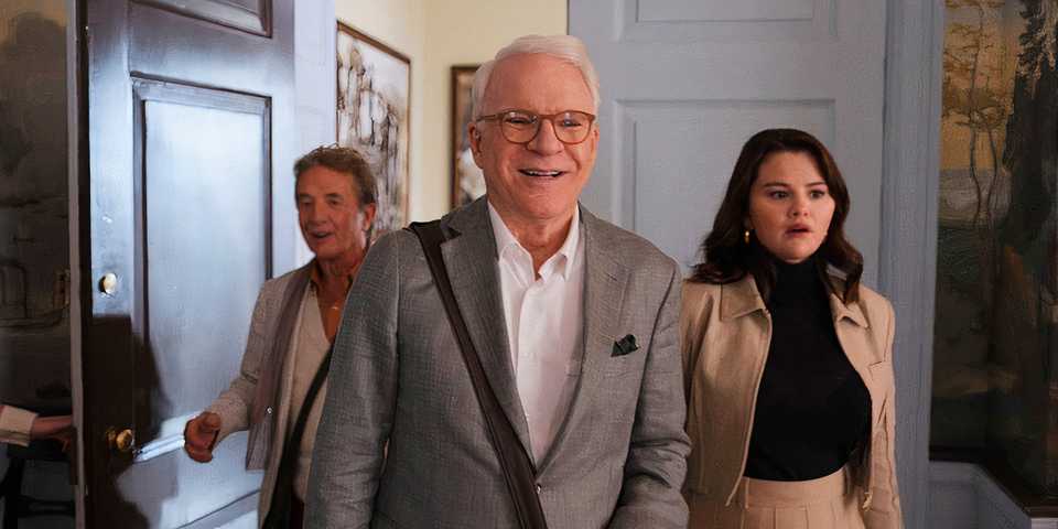 Charles walking in front of Mabel and Oliver in Only Murders in the Building.