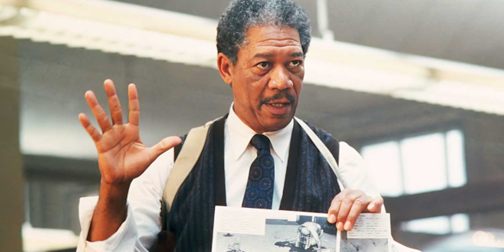 Morgan Freeman showing a picture to someone in Se7en