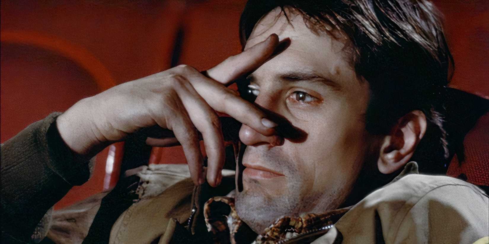 Robert De Niro alone at the movie theater in Taxi Driver