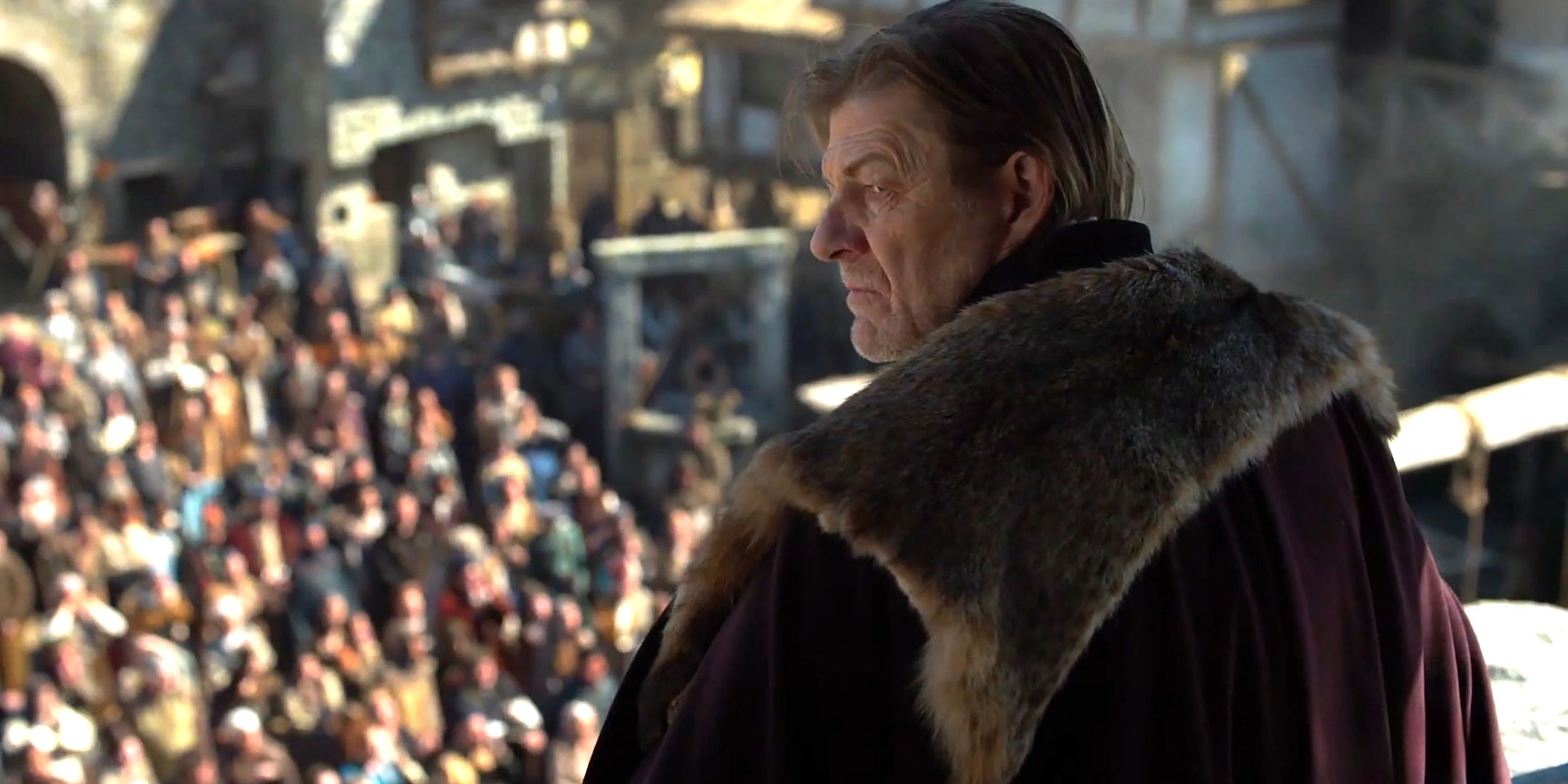 sean-bean-as-the-sheriff-of-nottingham-looking-menacingly-over-his-shoulder-while-standing-above-a-crowd-in-robin-hood.jpg