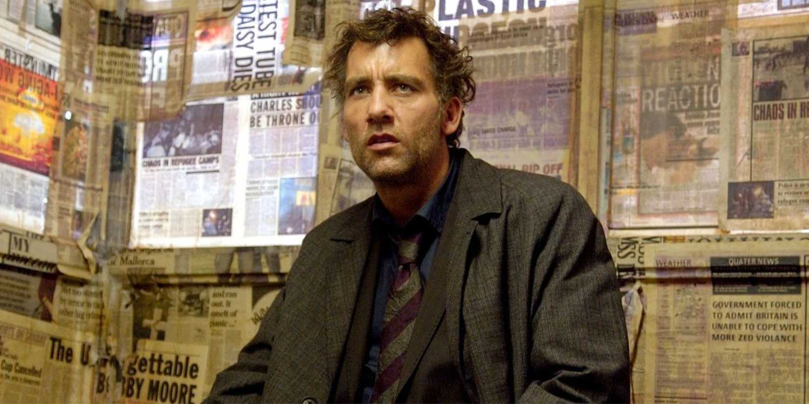 Clive Owen sitting and looking ahead in Children of Men