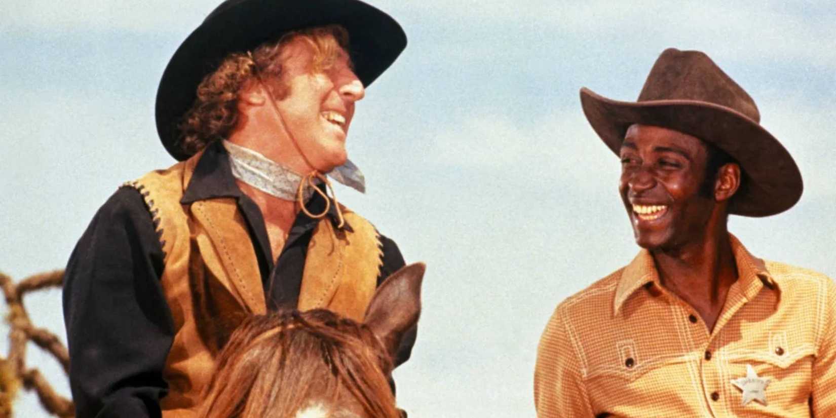 Gene Wilder and Cleavon Little laughing in Blazing Saddles