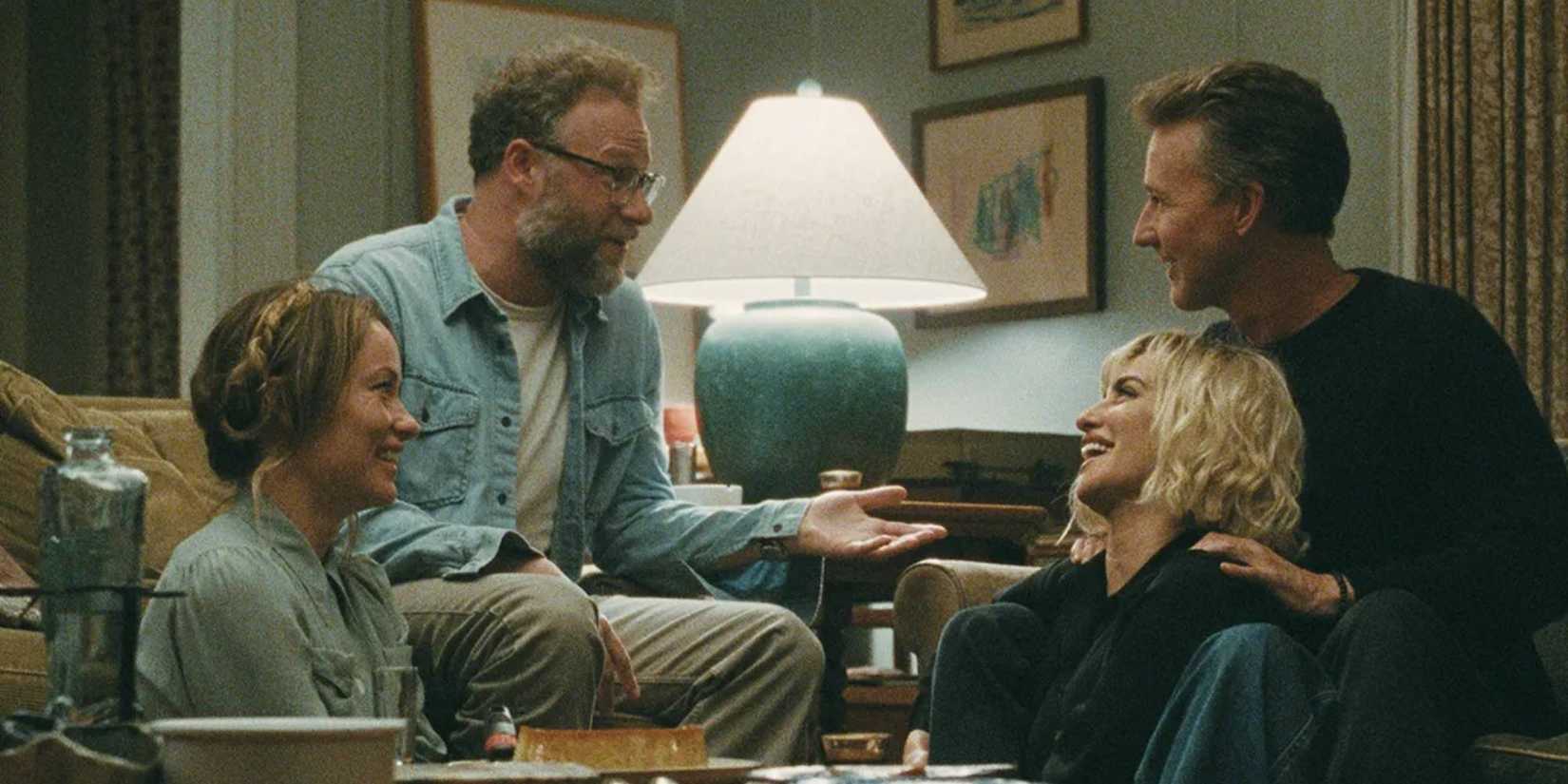 Olivia Wilde, Seth Rogen, Penélope Cruz, and Edward Norton laughing in The Invite