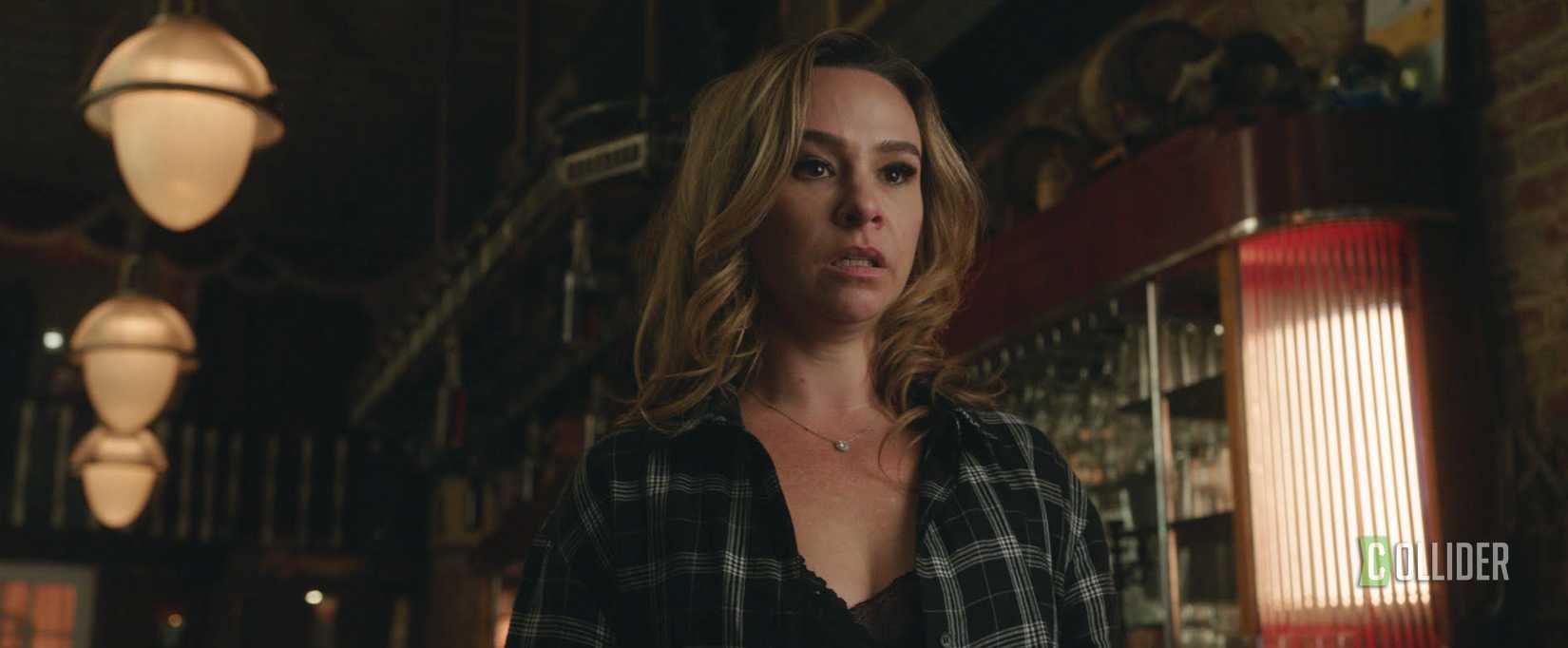 Danielle Harris standing in a cafe in The Devouring