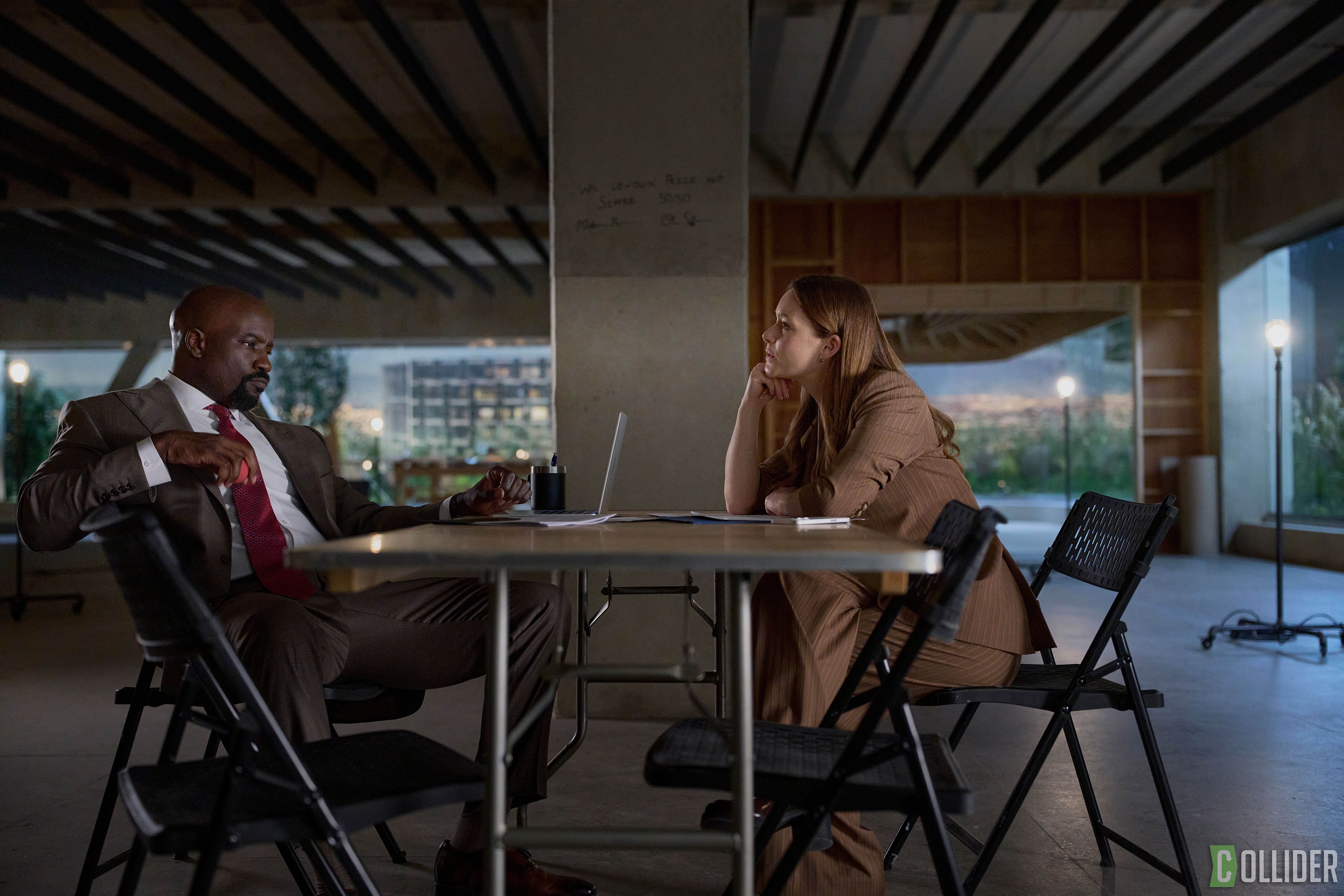 Mike Colter and Rachel Keller sitting across from each other at a table in Cupertino