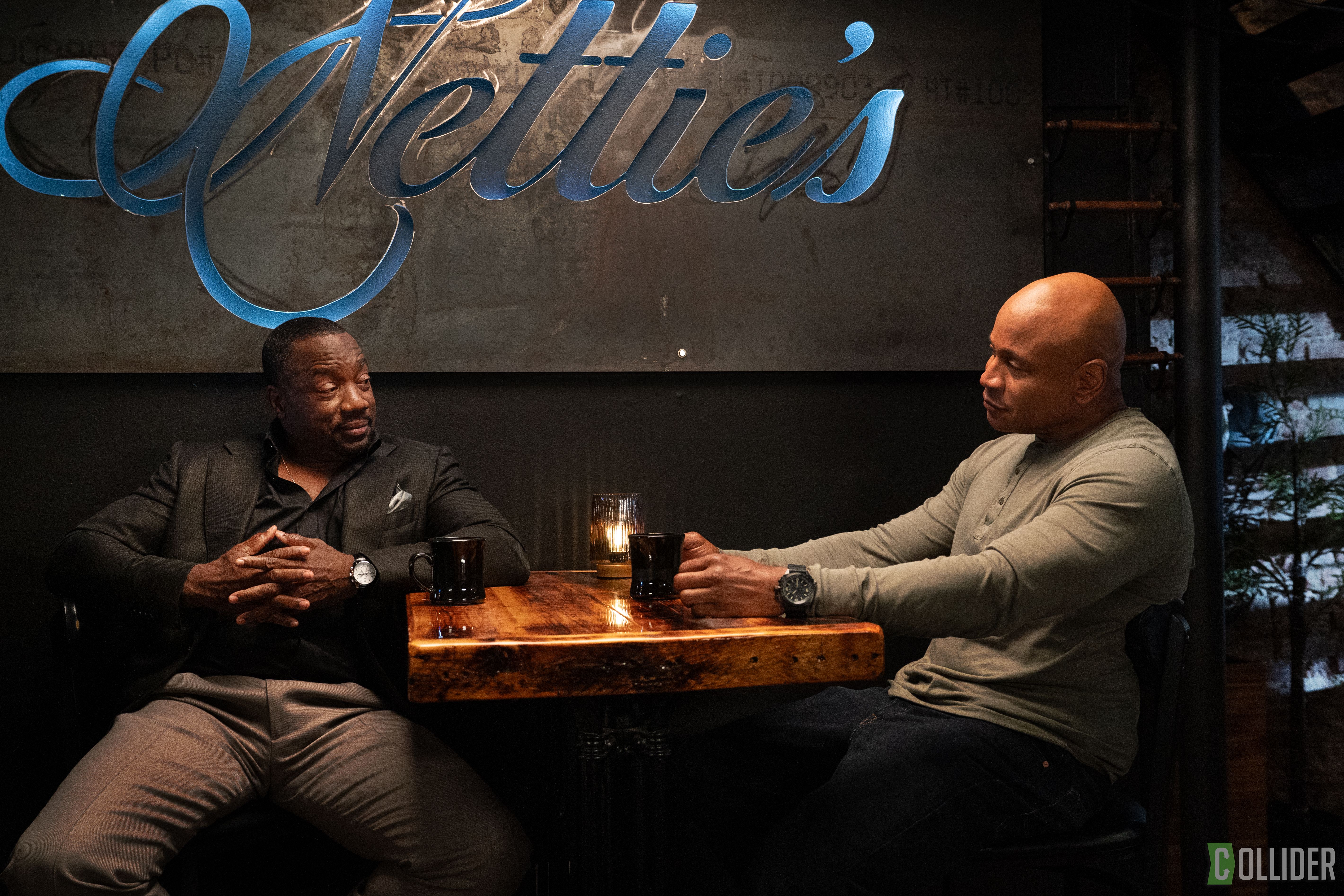 LL COOL J sitting down for drinks with a friend at Nettie's restaurant in NCIS: New York