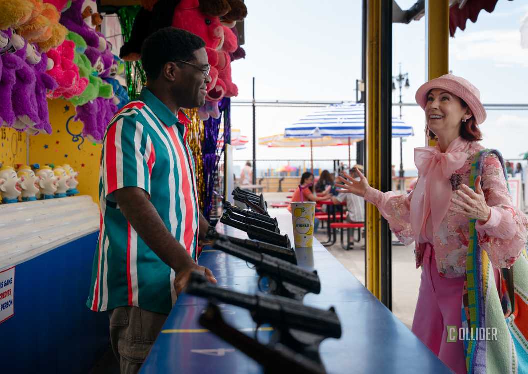Carrie Preston looking amazed at Sam Richardson's carnival booth in Elsbeth Season 4
